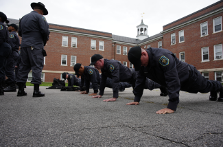 Correctional Officers doing Push-ups while on a physical training session.